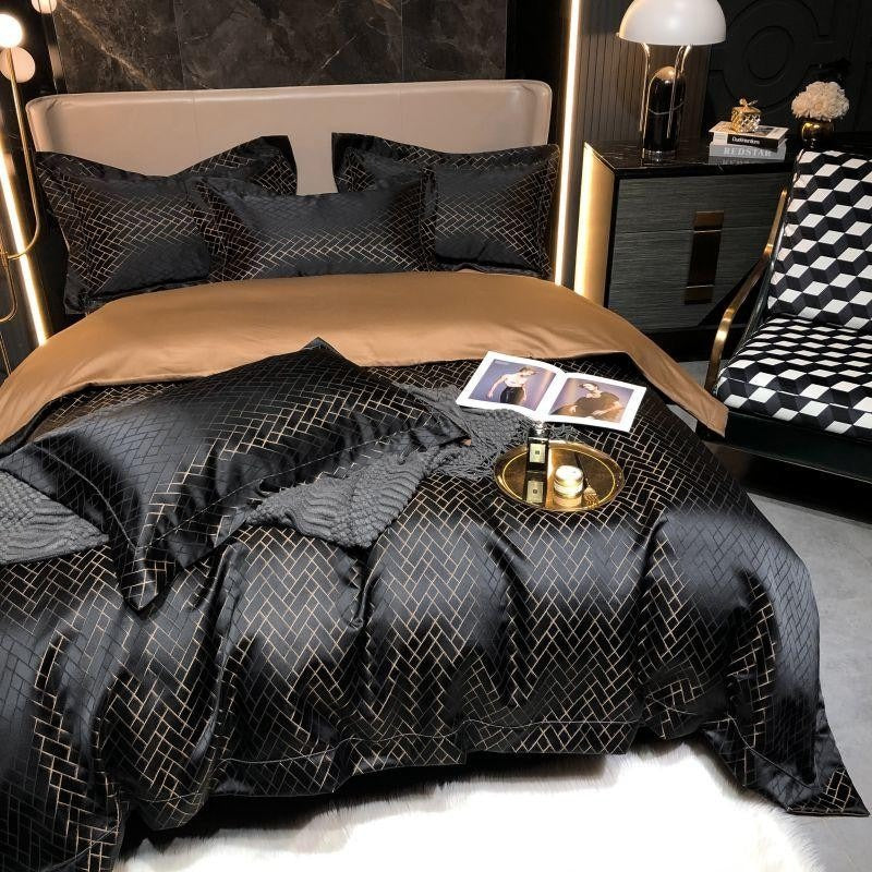 Luxury bedroom with black quilted bedding and gold accents