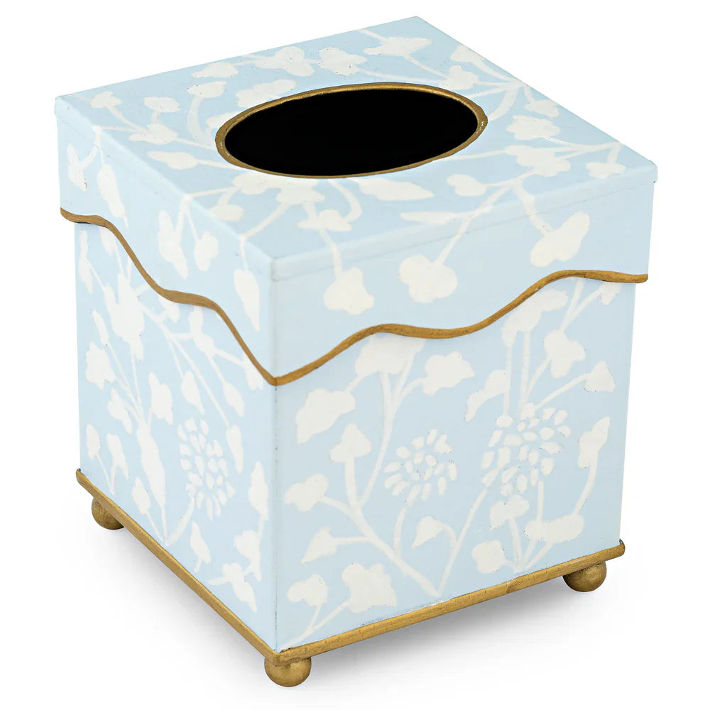 Tissue box cover with floral design on a light blue background