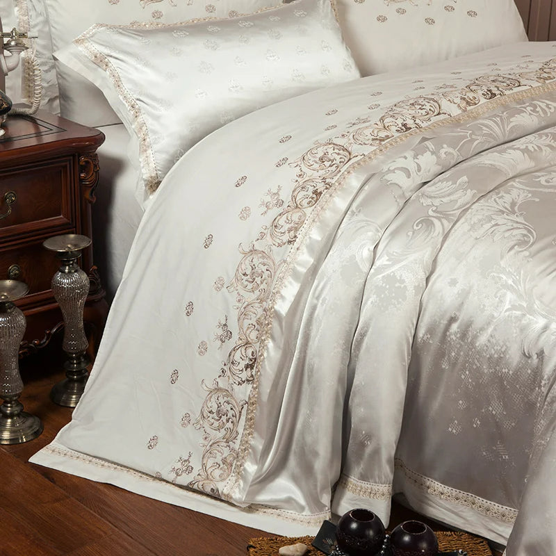 Luxurious bedspread with intricate patterns on a bed in a bedroom setting.