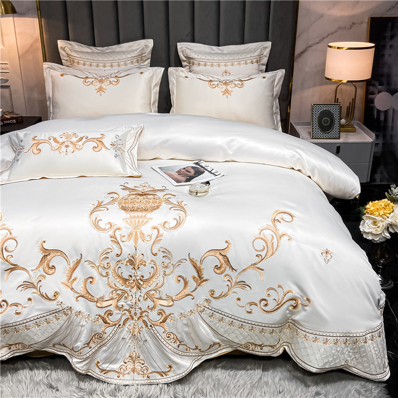 Luxurious bed with gold embroidery in a bedroom setting