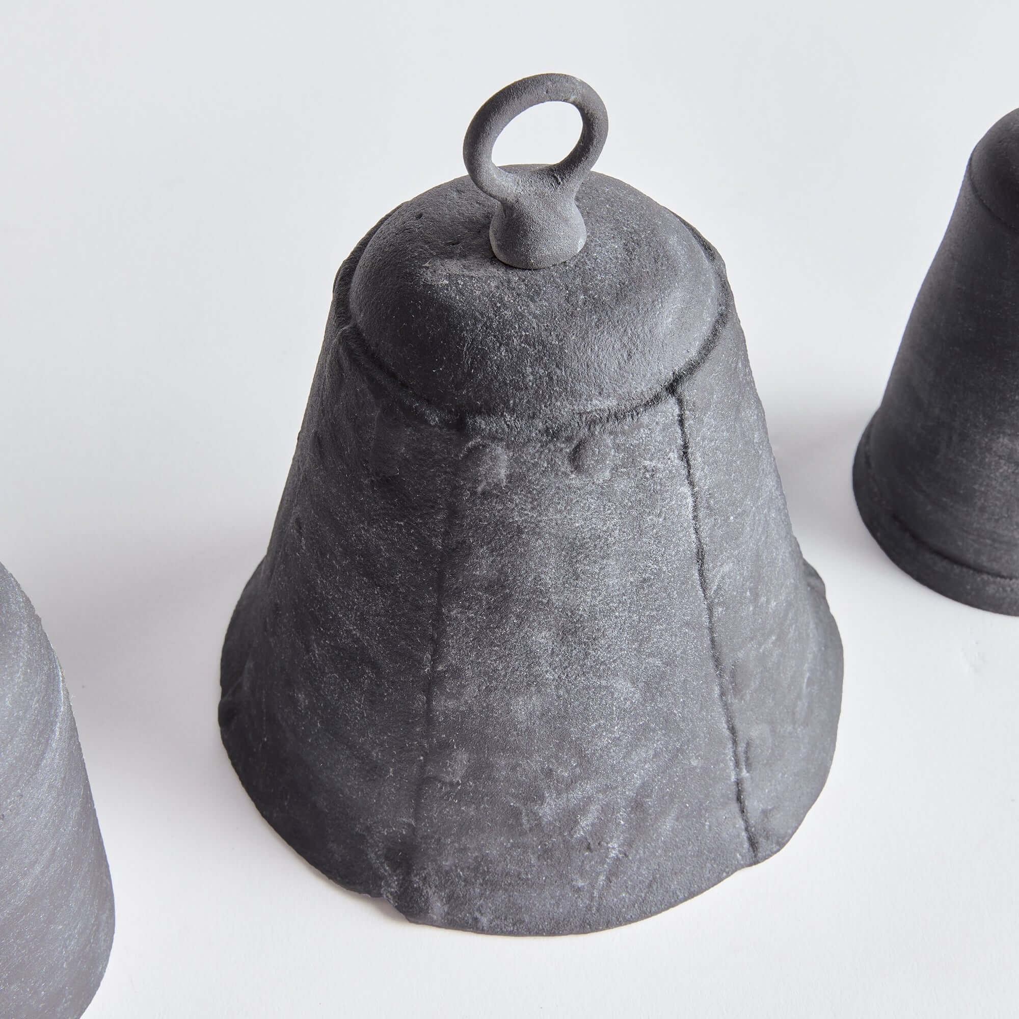 Black ceramic bell on a white background
