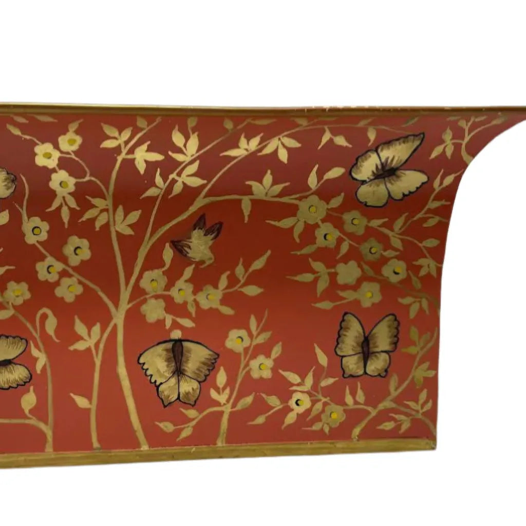 Close up of red and gold butterfly chinoiserie planter on a white background