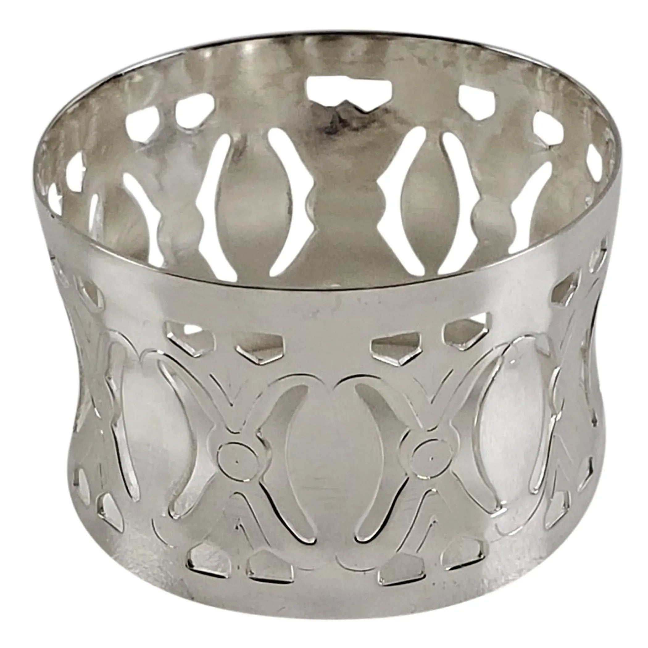 Silver-plated napkin ring with intricate cut-out cameo design on a white background