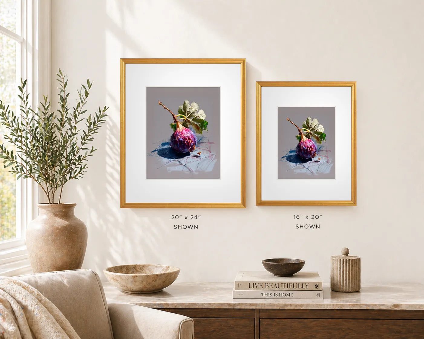 Framed whole fig still life wall art in antique gold frame, size comparison showing 20x24 and 16x20 frames in a calm, minimalist interior.