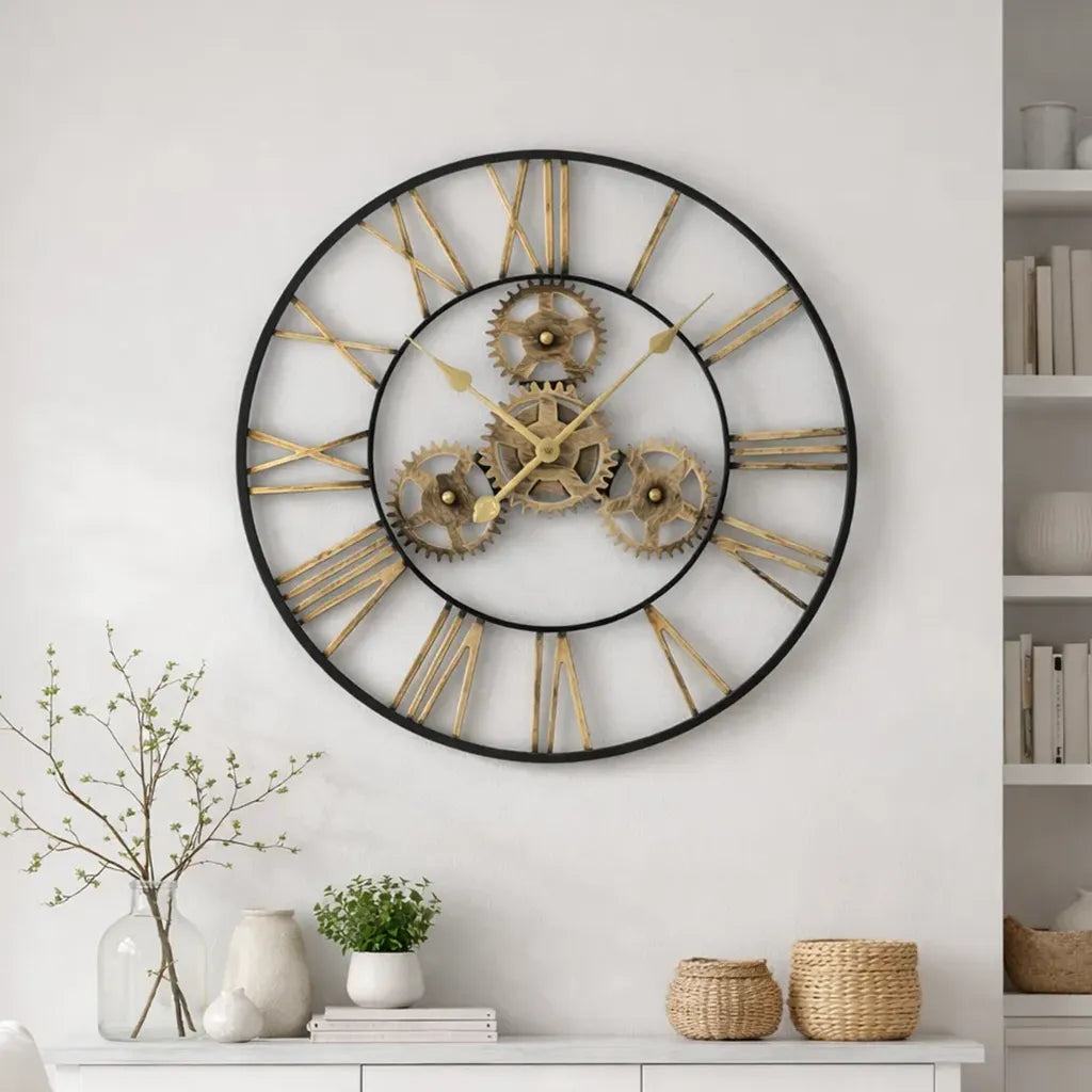 Large decorative wall clock with gold gears and Roman numerals on a white wall.