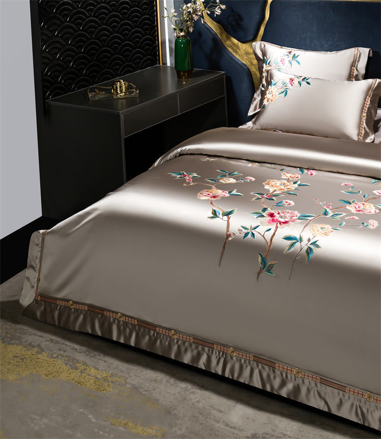 Bed with floral embroidery in a bedroom setting