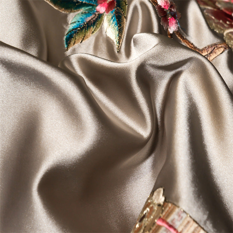 Silky fabric with floral embroidery in the background