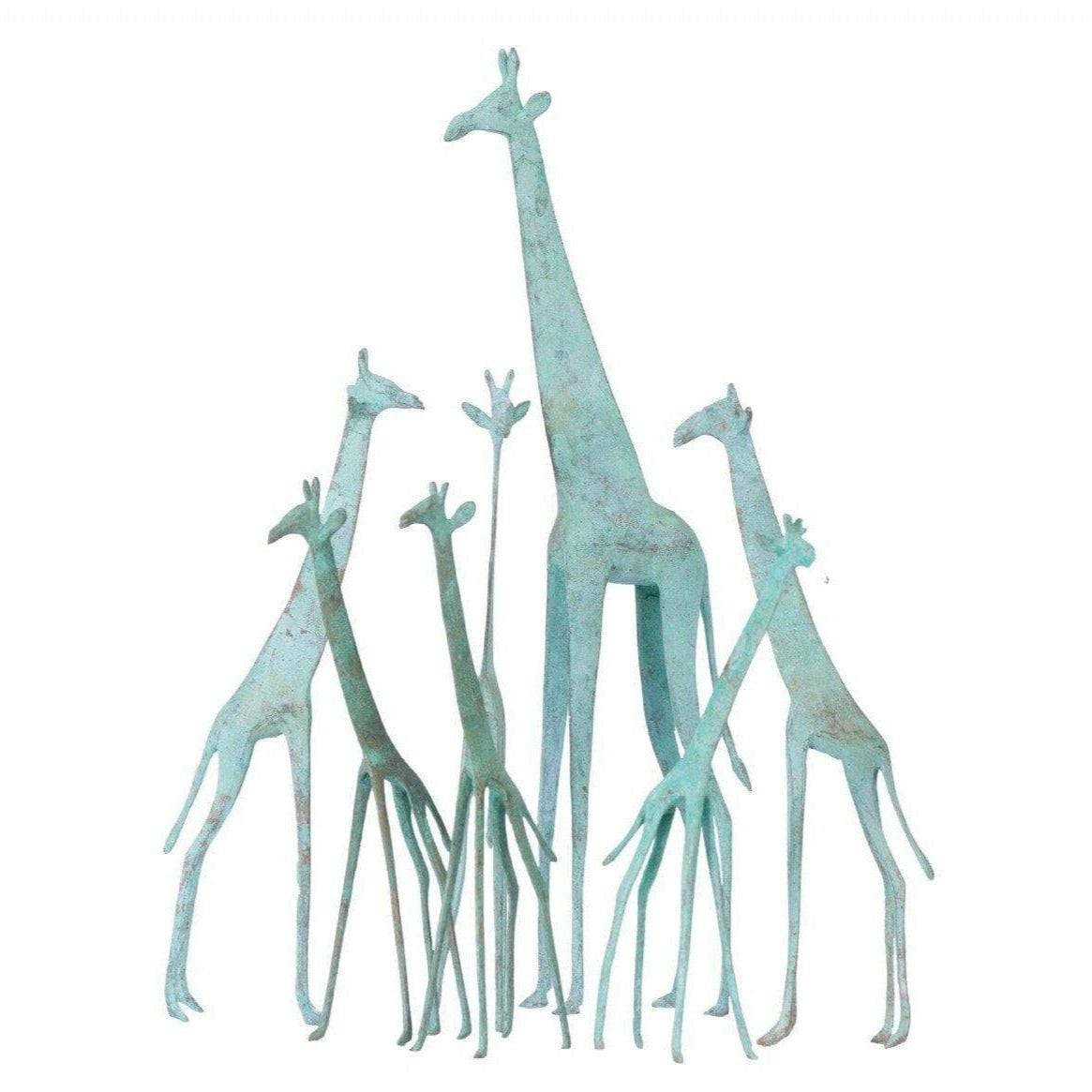 Set of decorative giraffes in a turquoise color on a white background