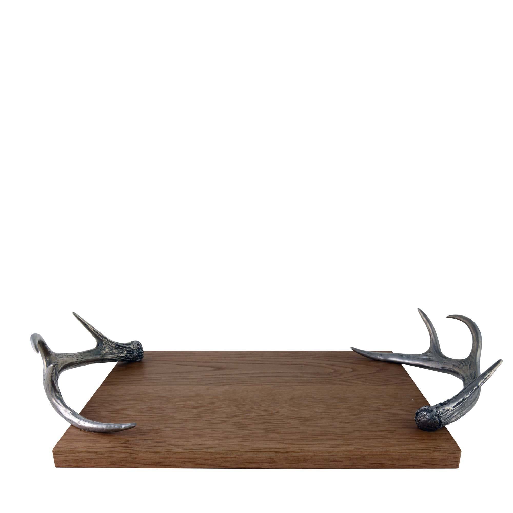 Wooden tray with pewter antler handles on a white background