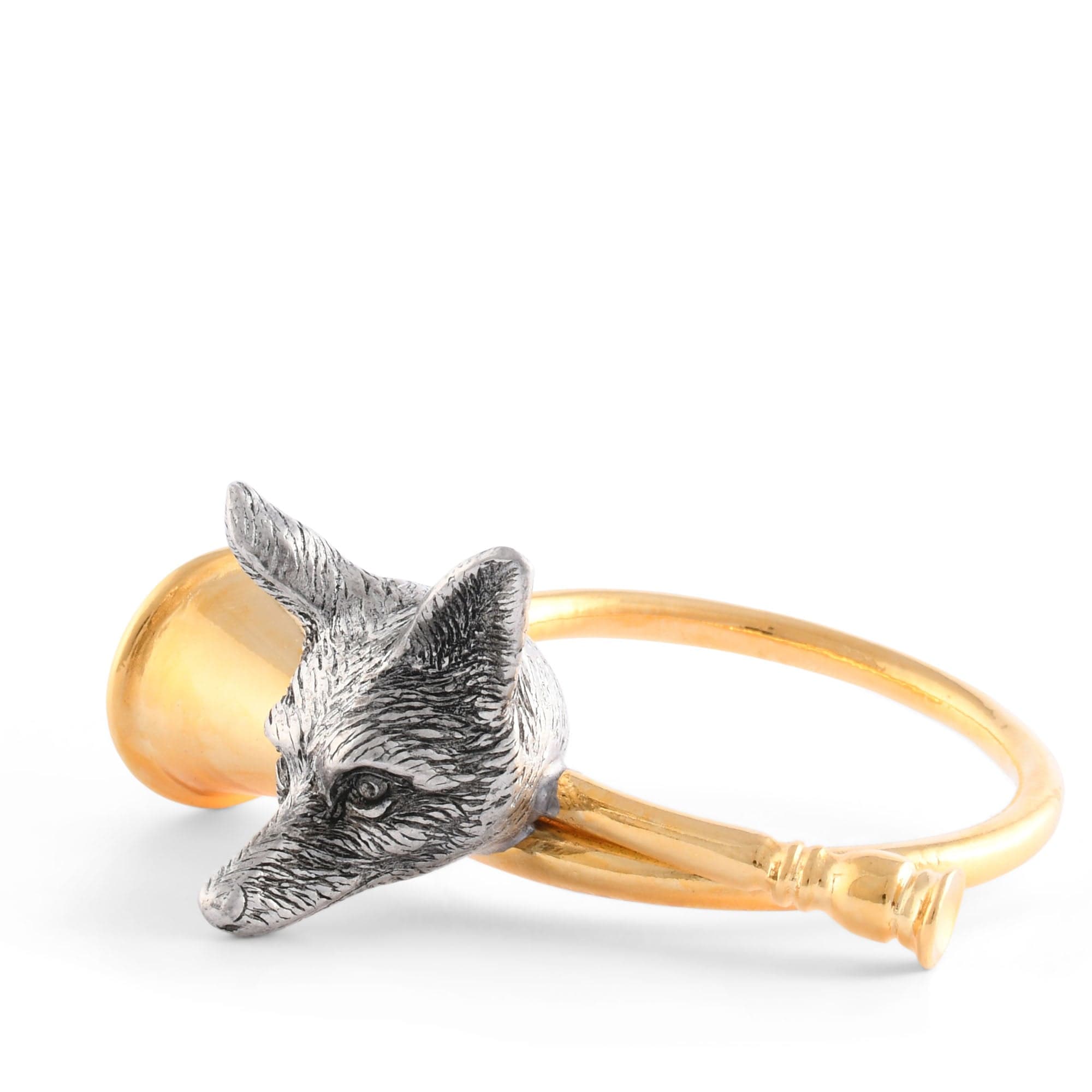 Napkin ring with pewter fox head design on a gold-toned hunting horn on a white background