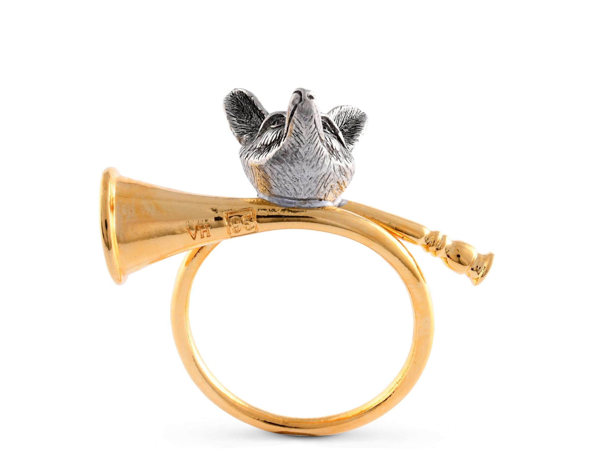 Underside of a gold-tone napkin ring with a pewter fox head and horn on a white background