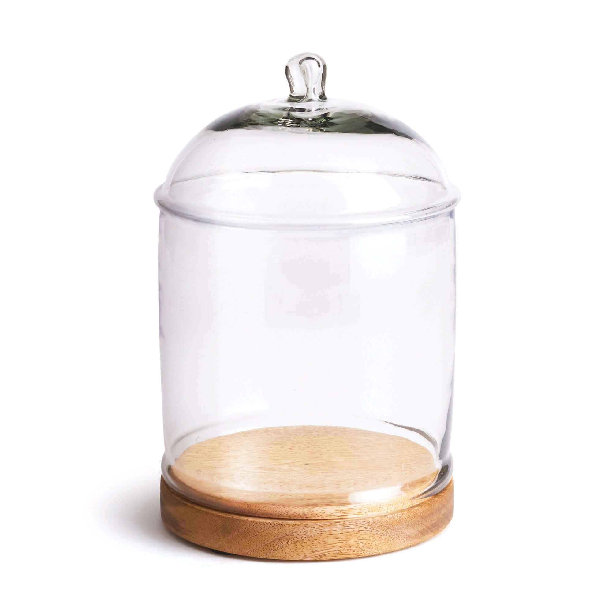 Clear glass cloche with wooden base and lid on a white background