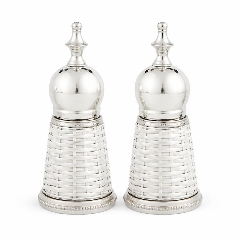 Two silver and white wicker salt and pepper shakers on a white background