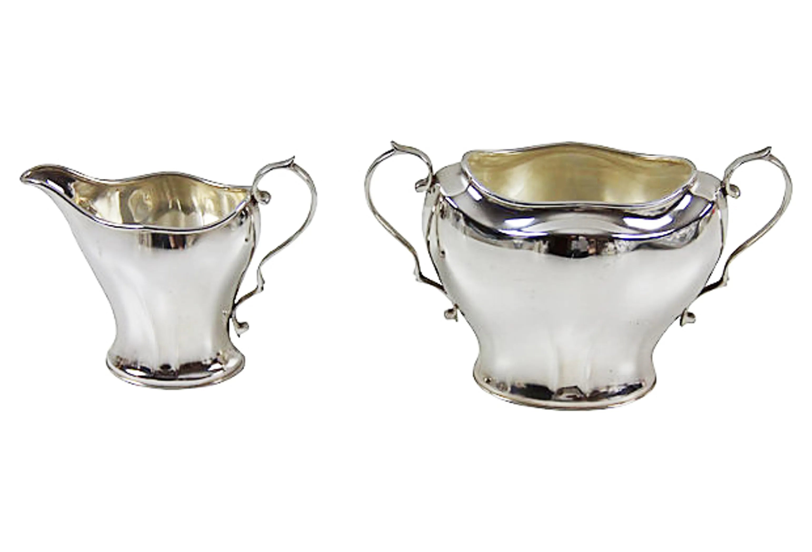 Silver plated Sugar bowl and creamer on a white background