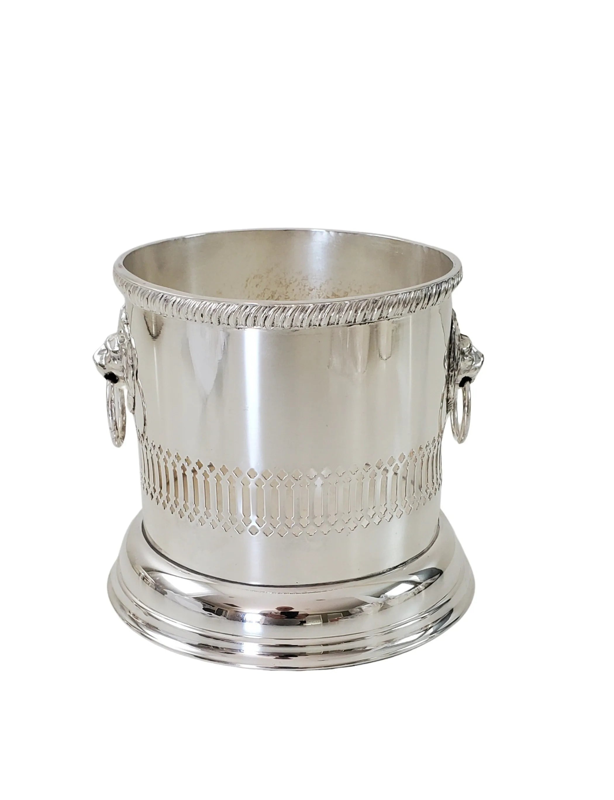 Silver ice bucket with decorative patterns on a white background