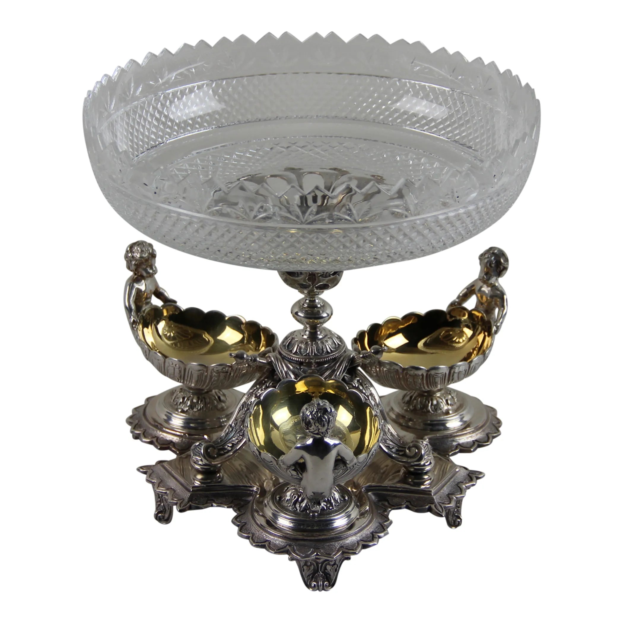 Decorative glass bowl with silver and gold base on a white background