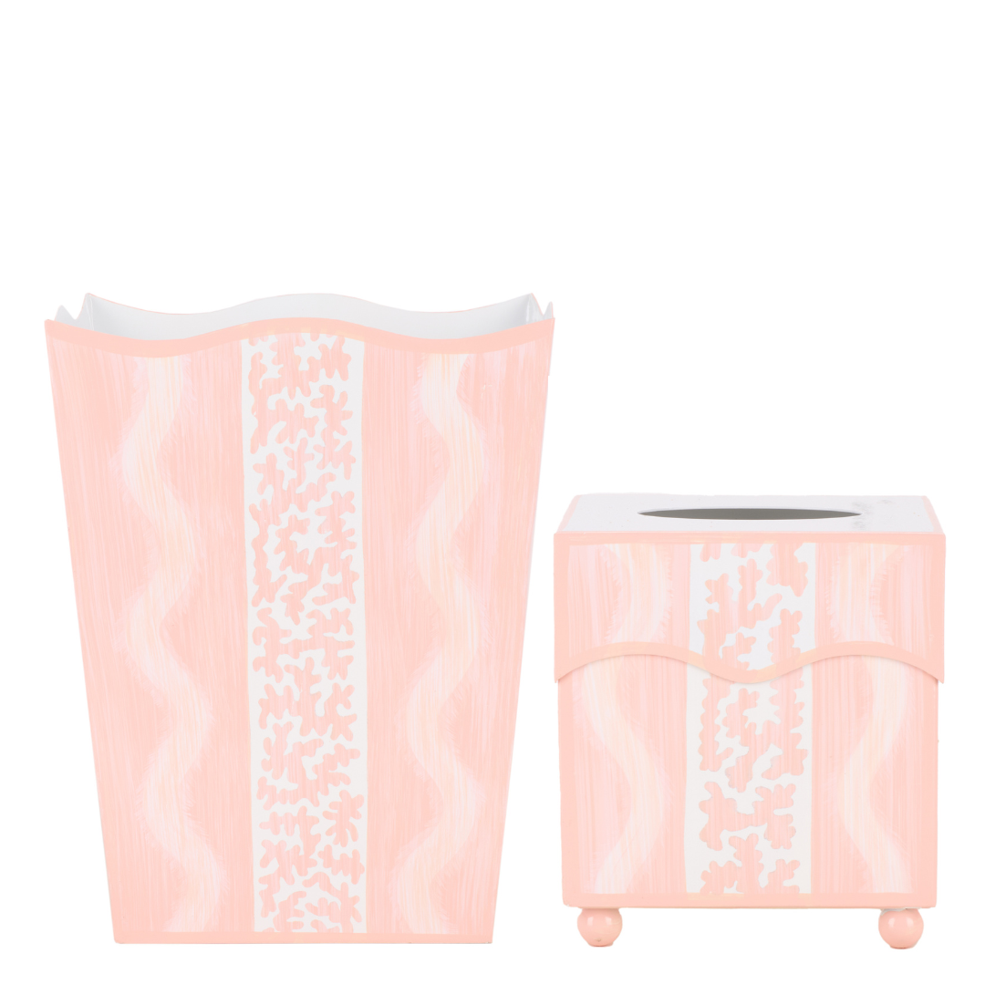 Set of pink trash can and tissue box holder with white pattern on a white background