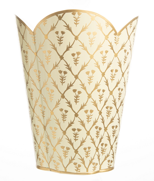 Decorative trash can with gold floral pattern on a white background