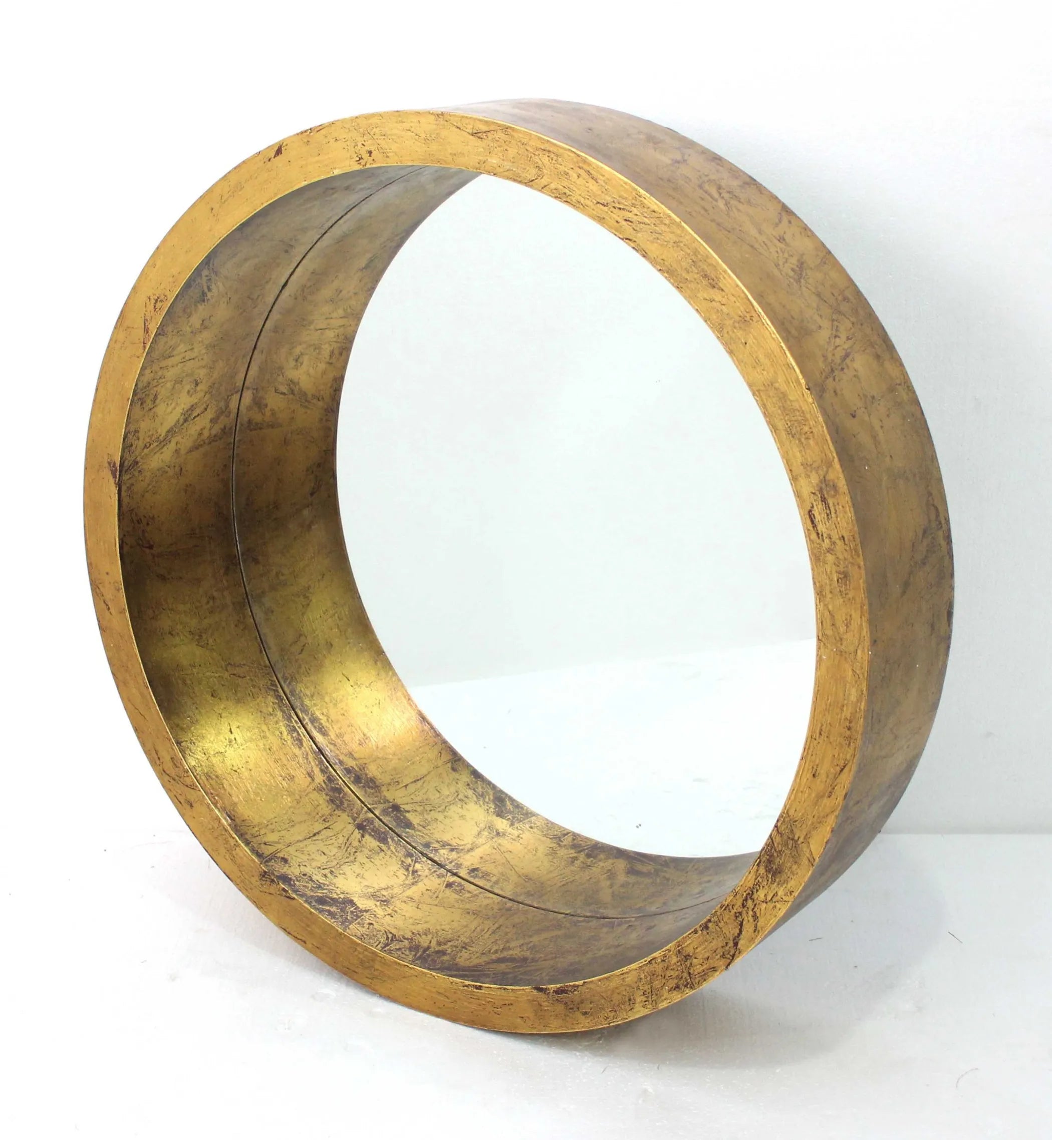 Gold circular object on a white background