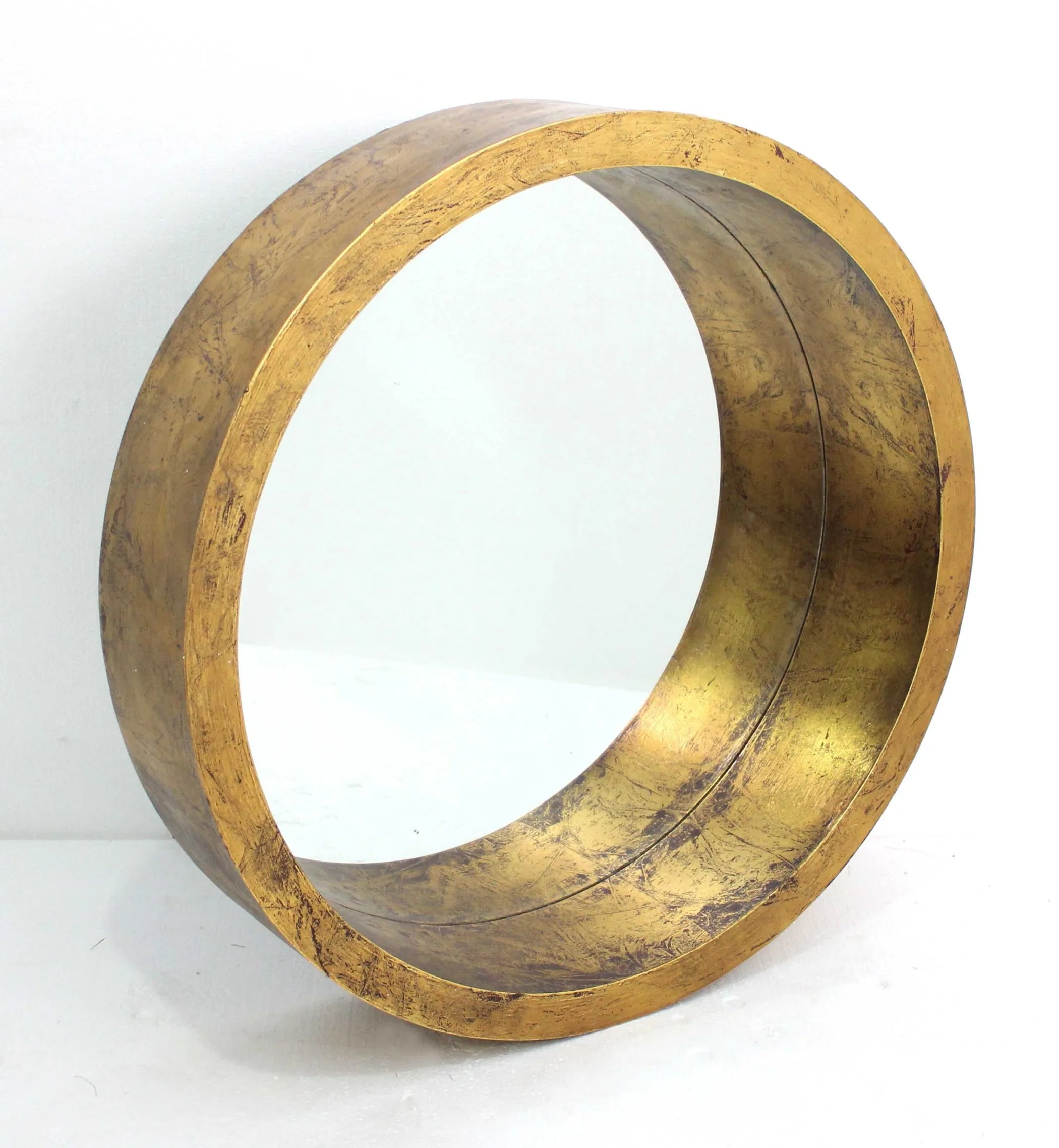 Gold metal ring on a white background