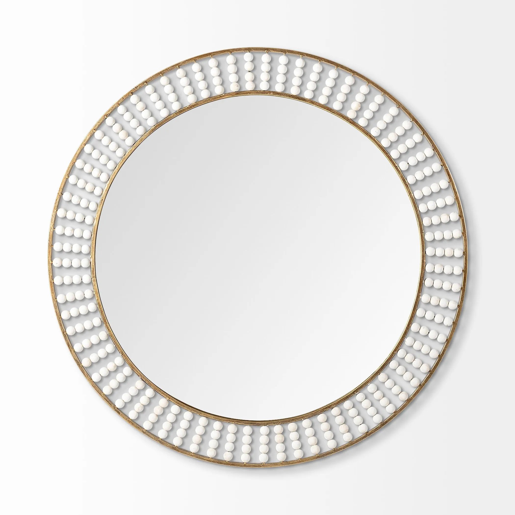 Round mirror with decorative white bead border on a light gray background