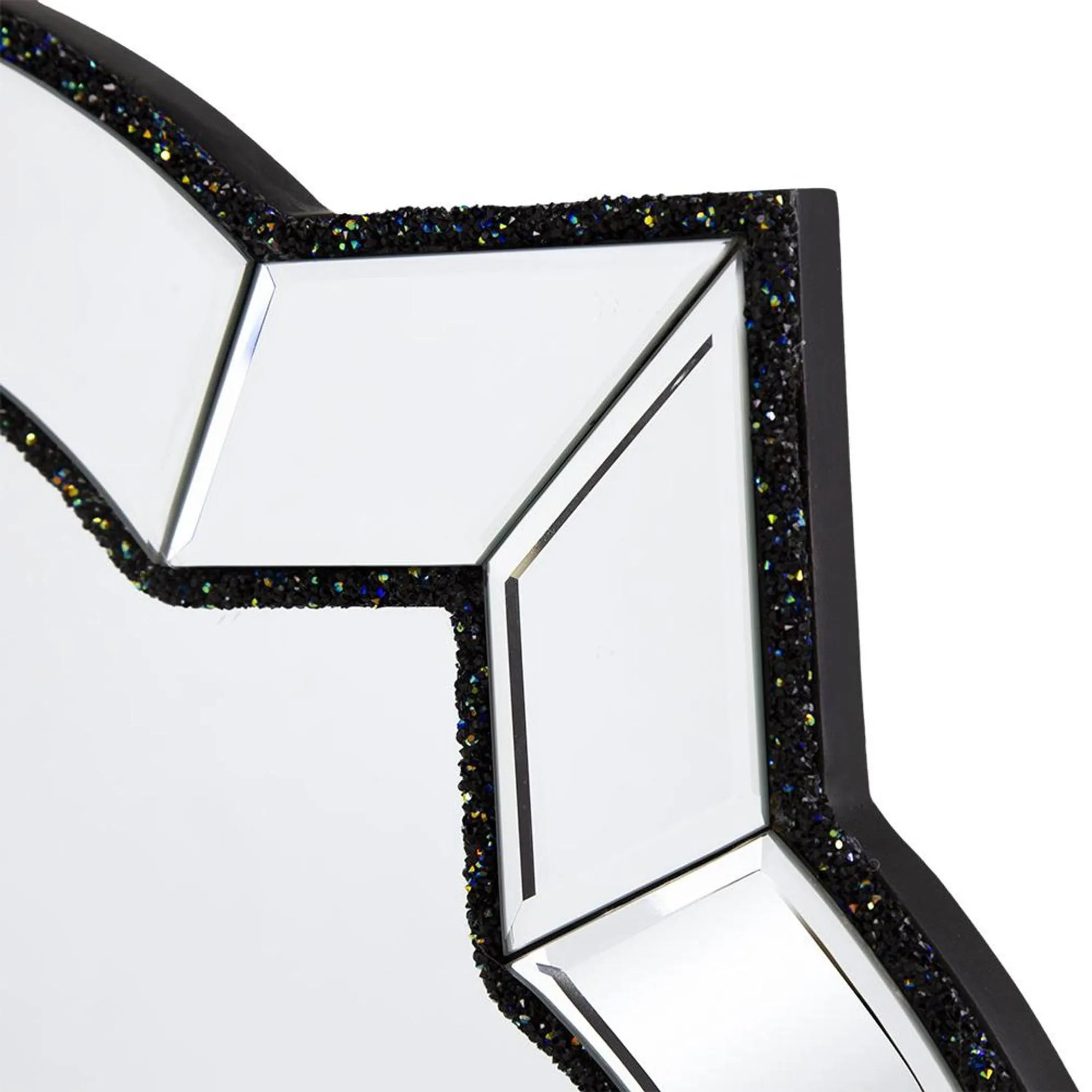Star-shaped object with a reflective surface and black glittery border on a white background