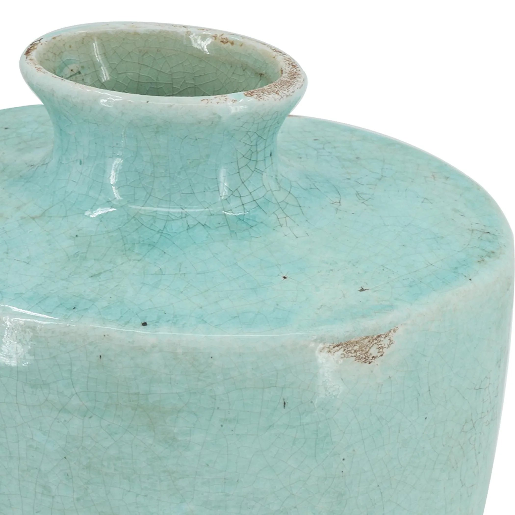 Close-up of a turquoise ceramic vase with a cracked glaze texture.