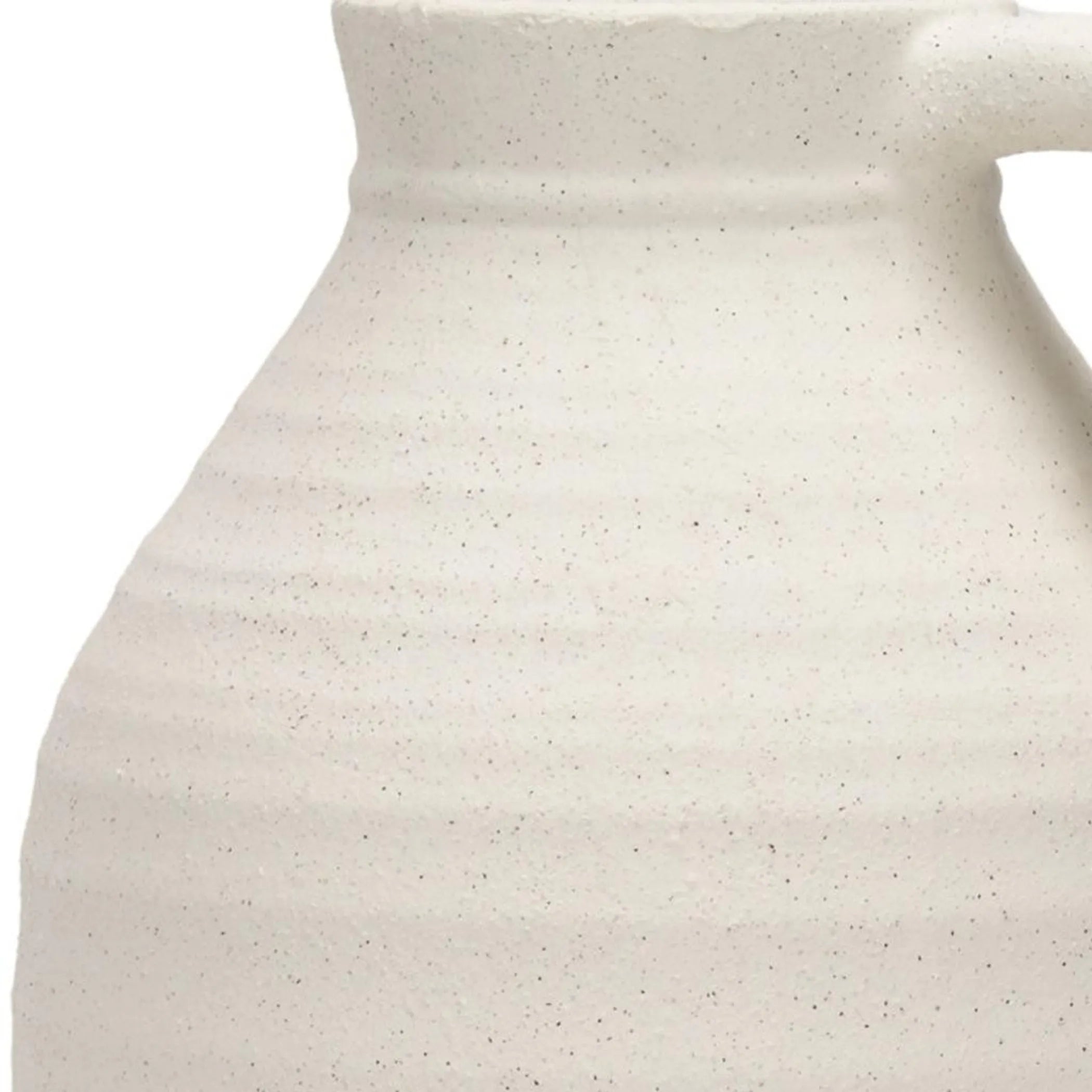 Close-up of a speckled ceramic pitcher on a white background