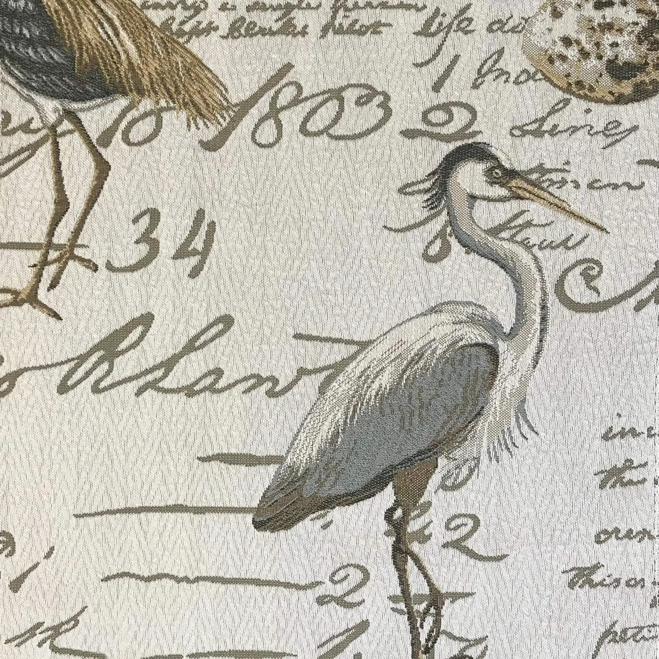 Decorative fabric with heron illustration and vintage text pattern