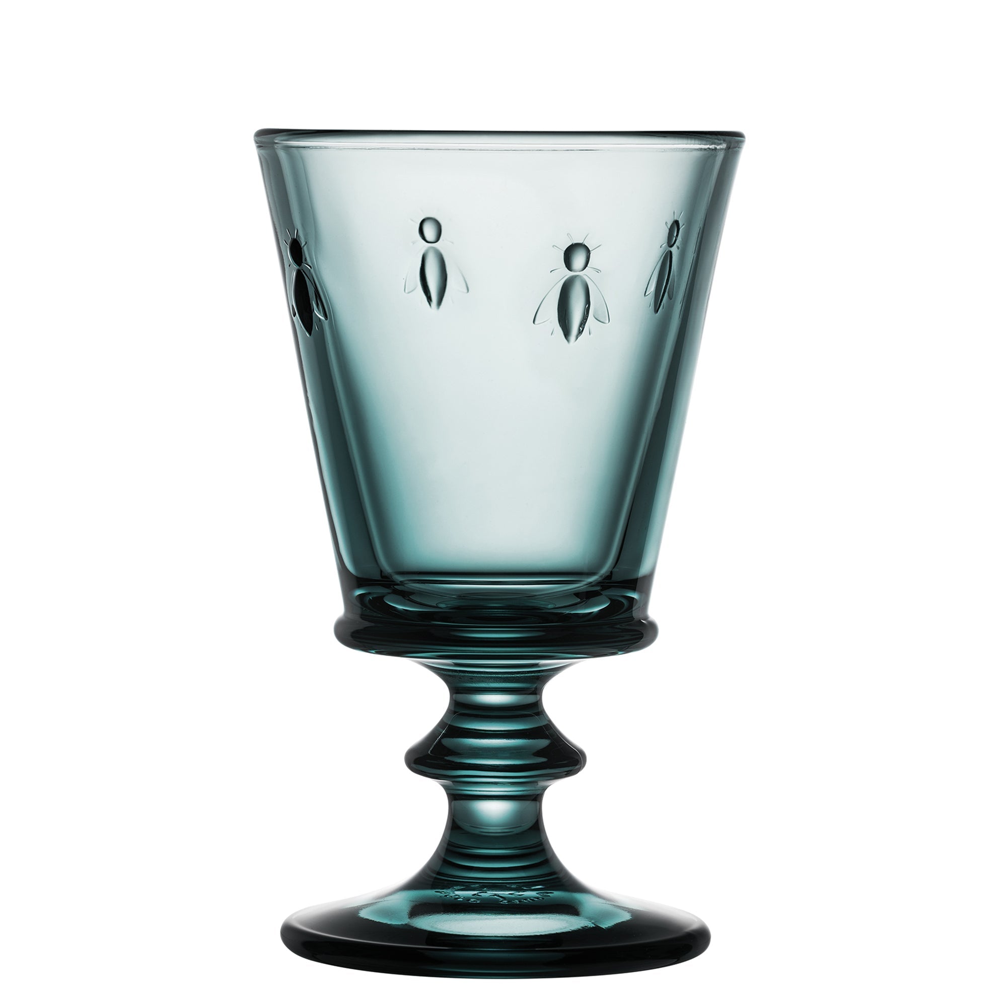 Teal glass with embossed designs on a white background