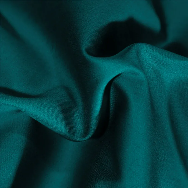 Close-up of teal fabric with folds