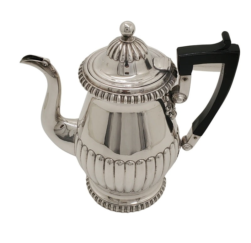 Antique Silver Plated coffee pot with a black handle on a white background