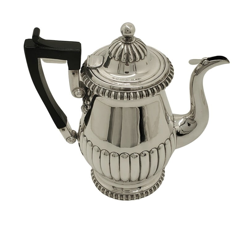 Silver Old Sheffield Coffee Pot c.1800 fluted with black handle on a white background