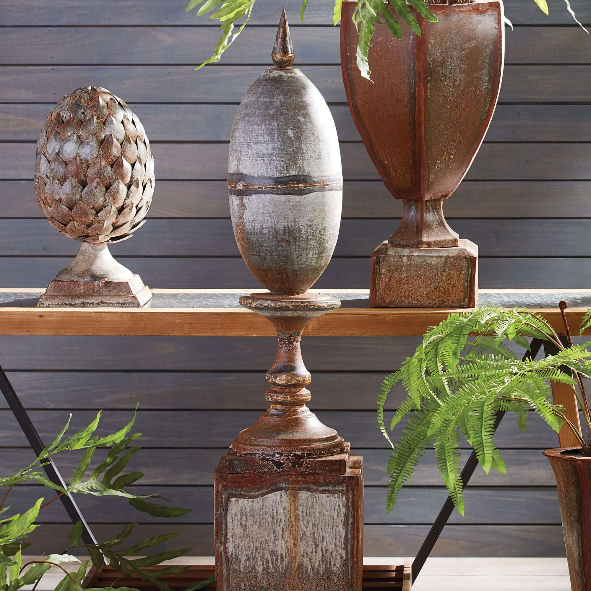 Decorative urns on a wooden shelf with a wooden wall background