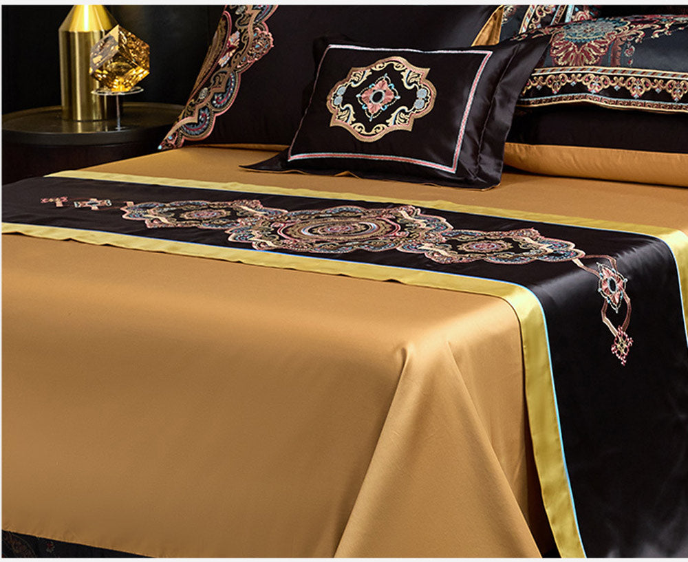 Decorative bedspread with intricate patterns on a bed