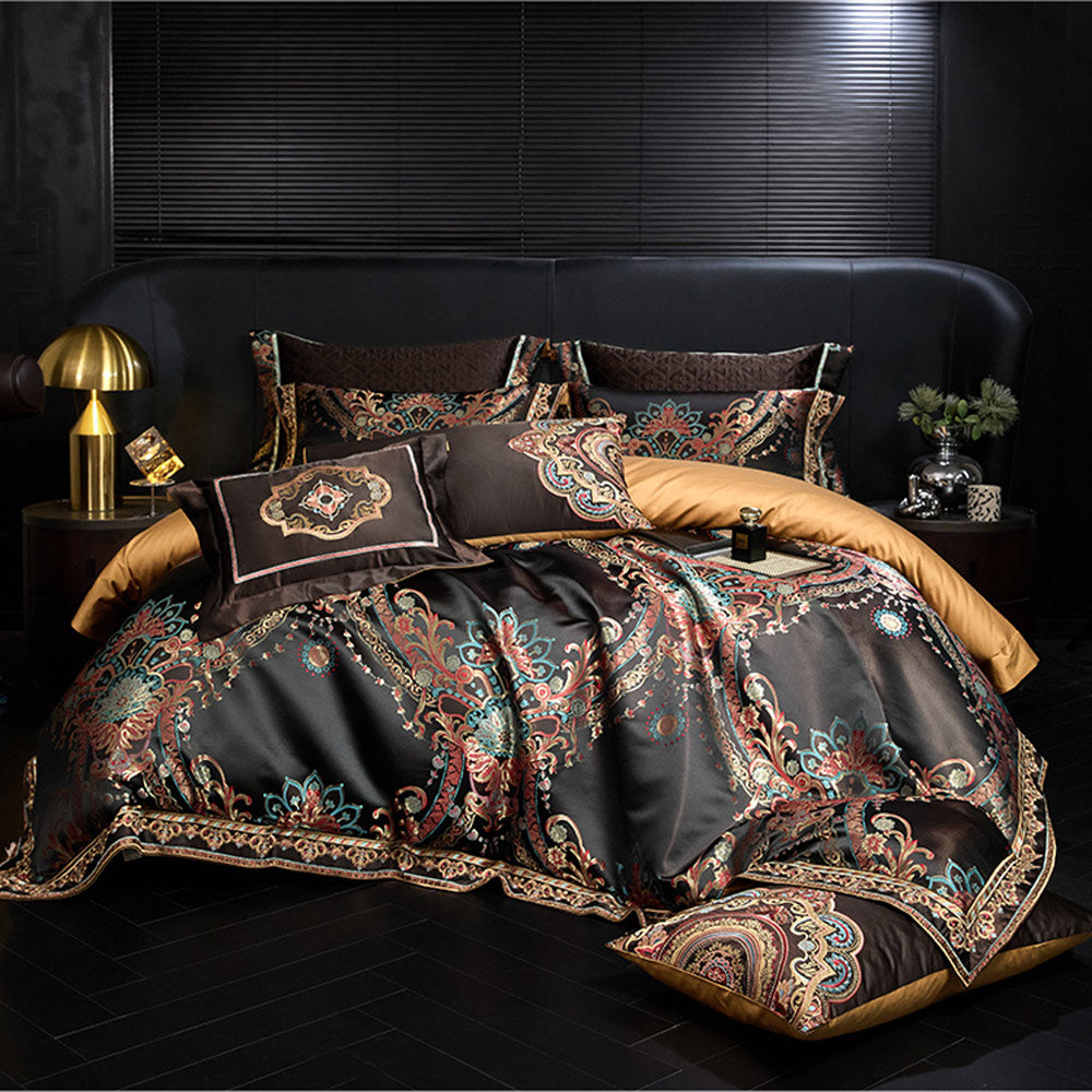 Decorative bedspread set with intricate patterns on a dark background