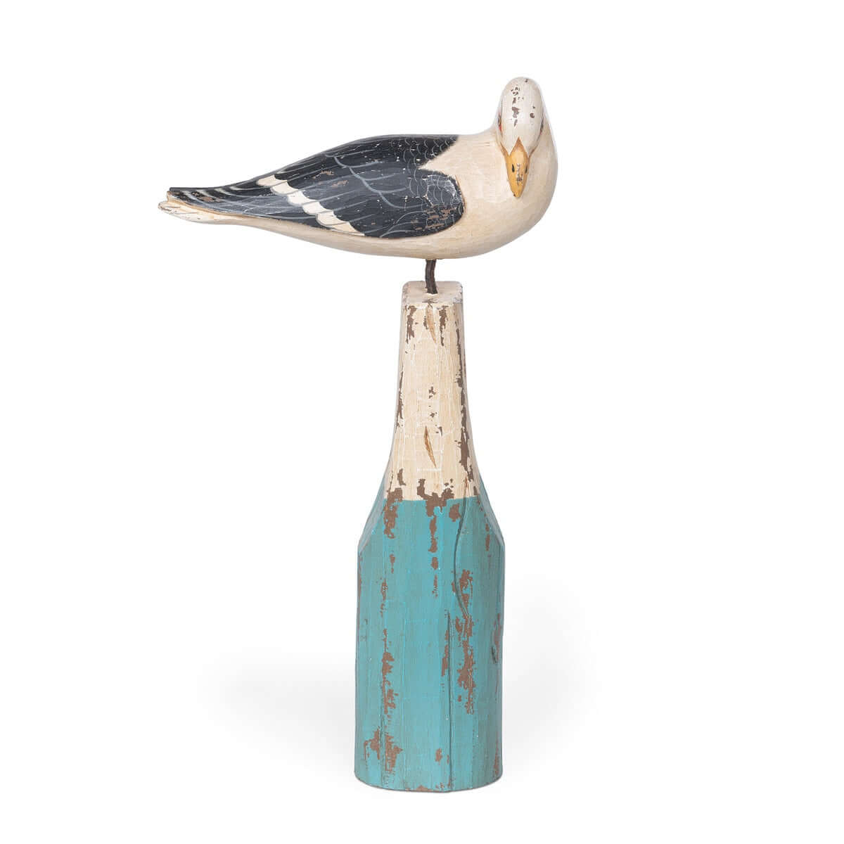 Decorative seagull perched on a bottle with a white background