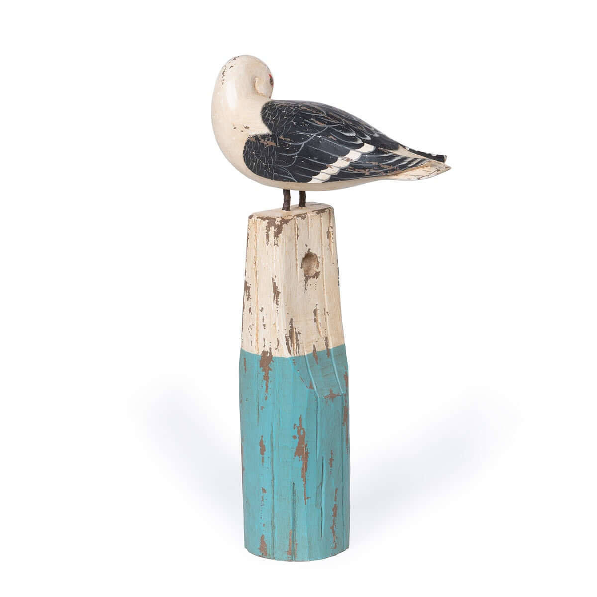 Decorative bird sculpture on a wooden pedestal with a white and blue design.