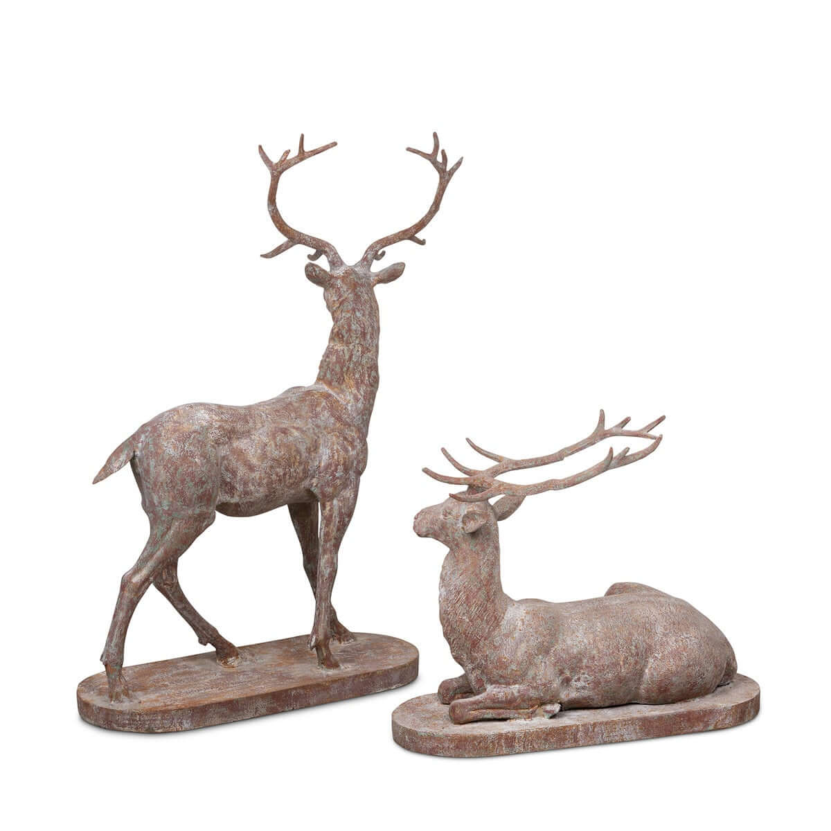 Two deer statues, one standing and one lying down, on a white background