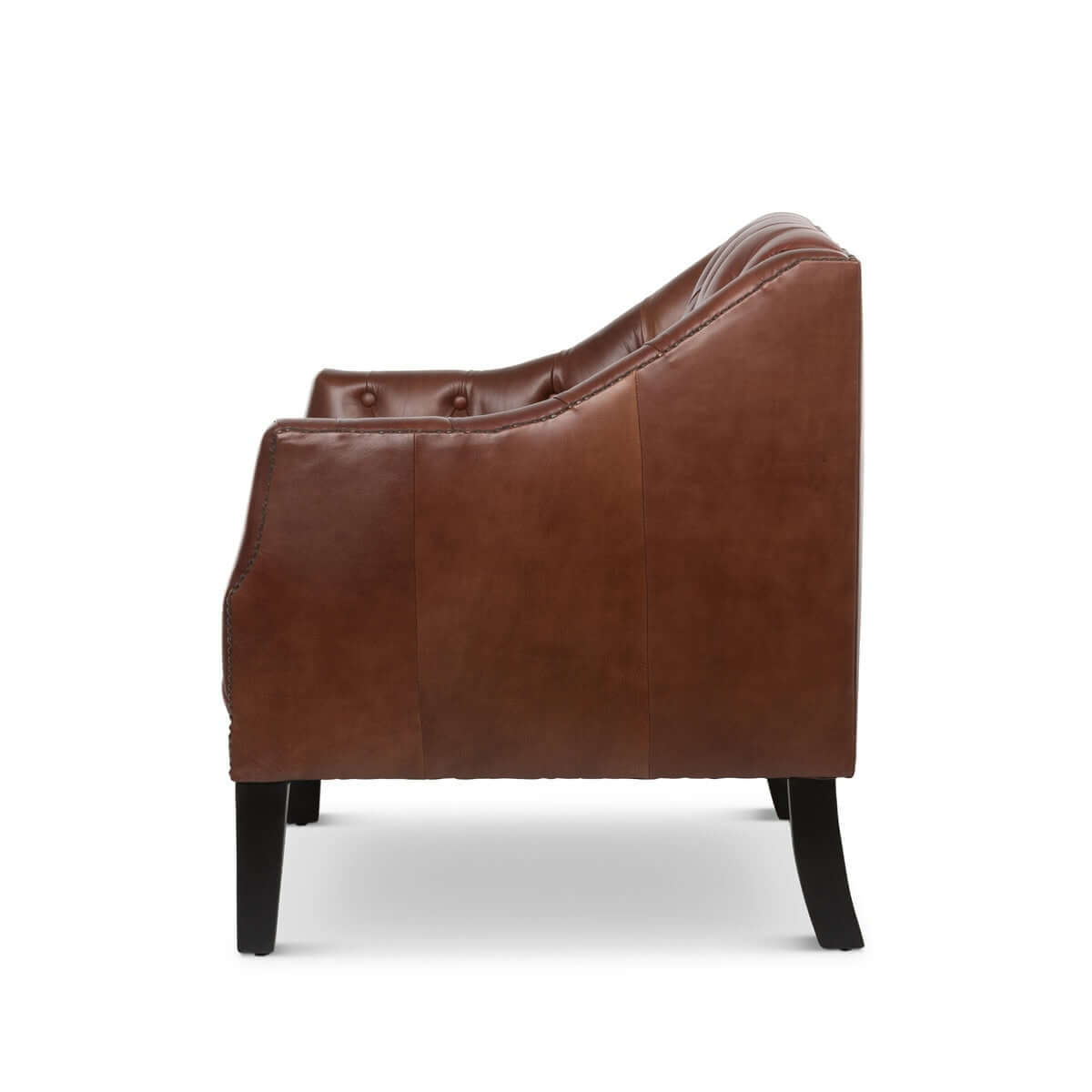 Side view of a brown leather armchair on a white background