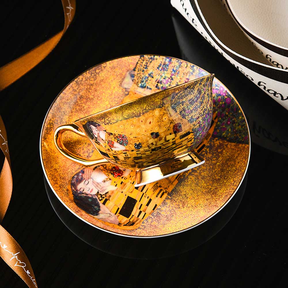 Teacup and saucer with artistic design on a dark background
