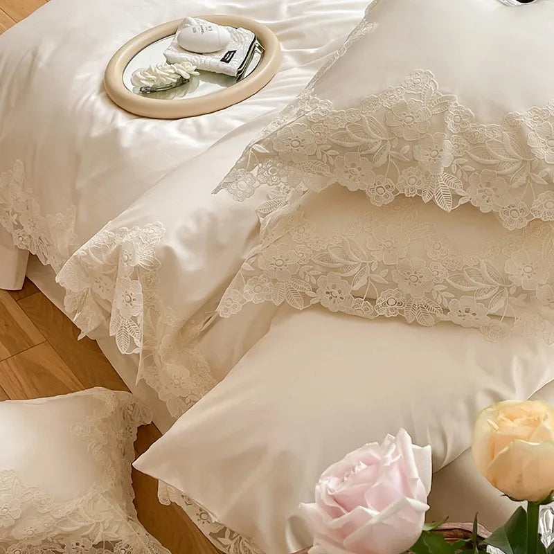 Lace-trimmed bedding set with roses on a wooden floor