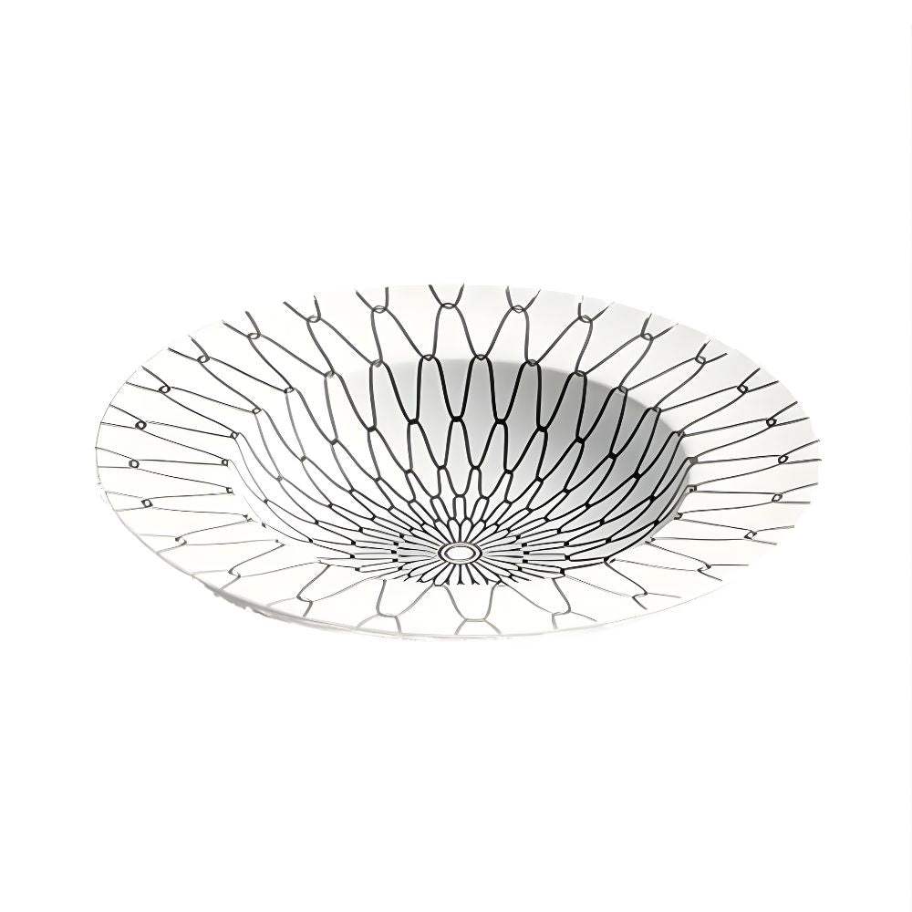 Decorative glass bowl with intricate black pattern on a white background
