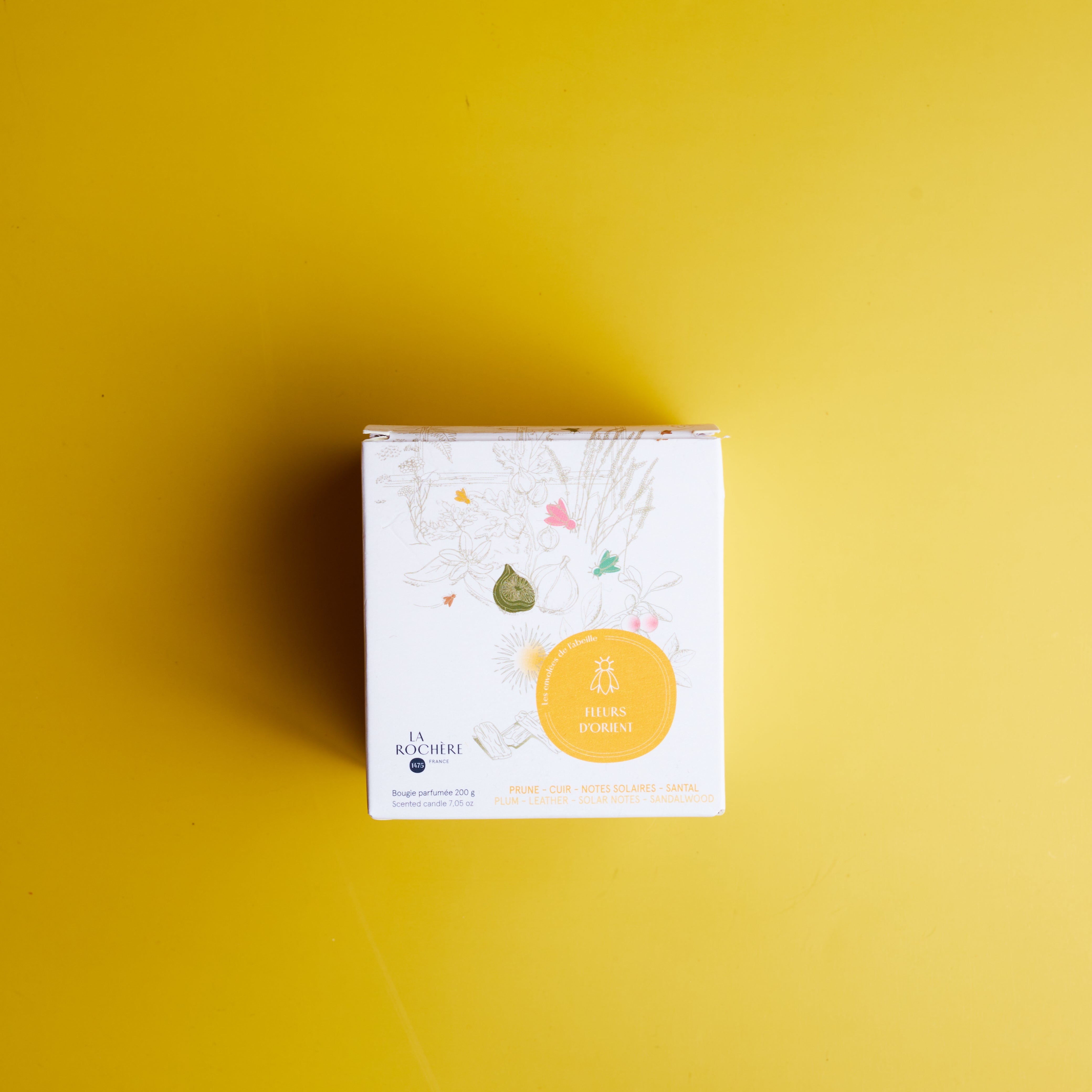 La Rochère White product packaging with a yellow label on a mustard yellow background