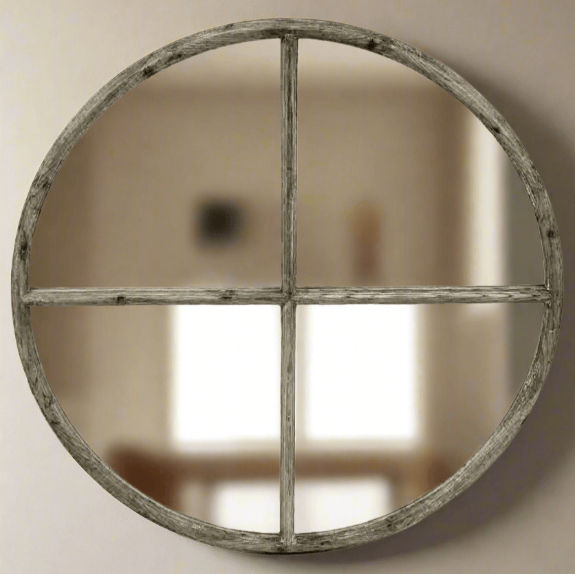 Round mirror with a rustic wooden frame on a wall