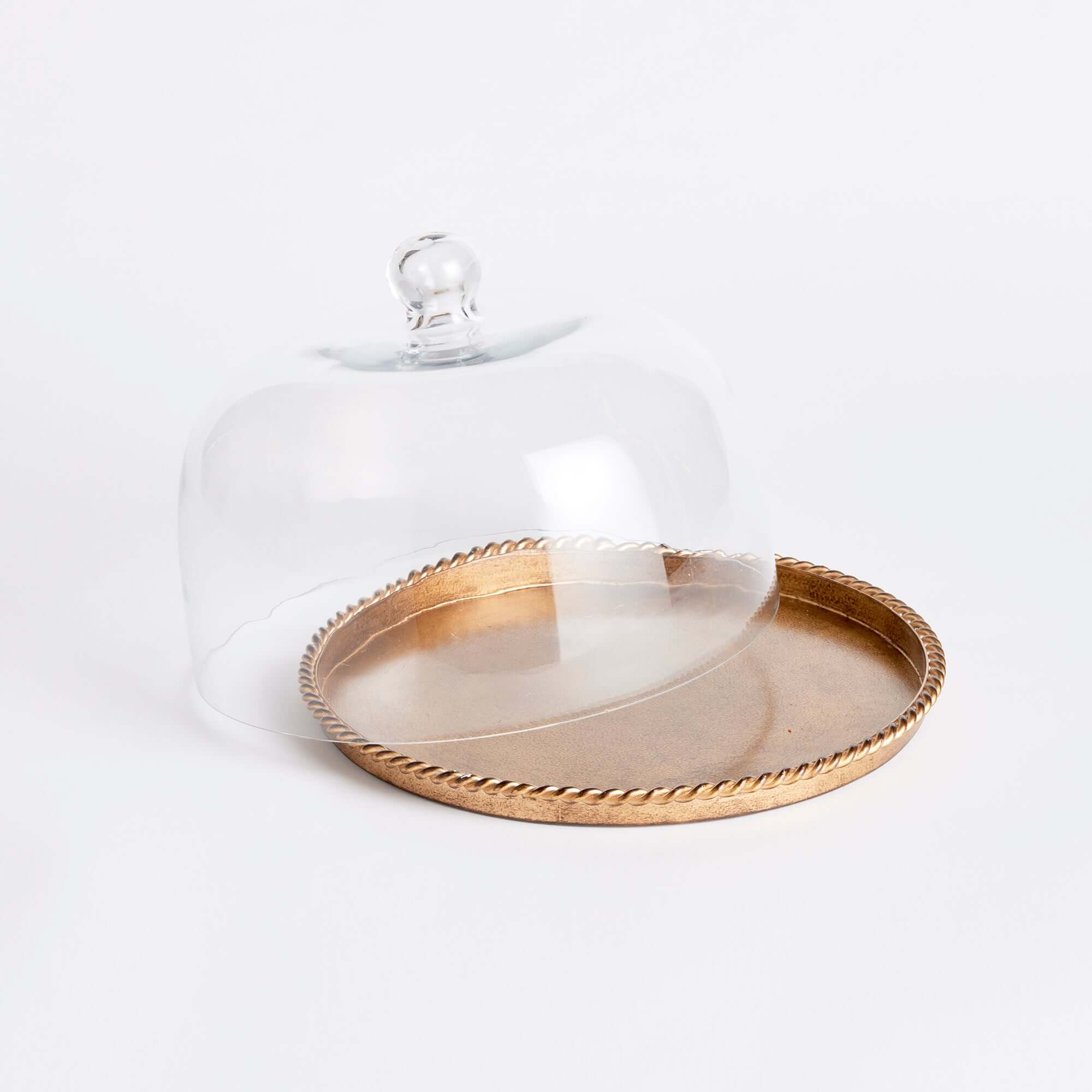 Decorative tray with a glass dome on a white background