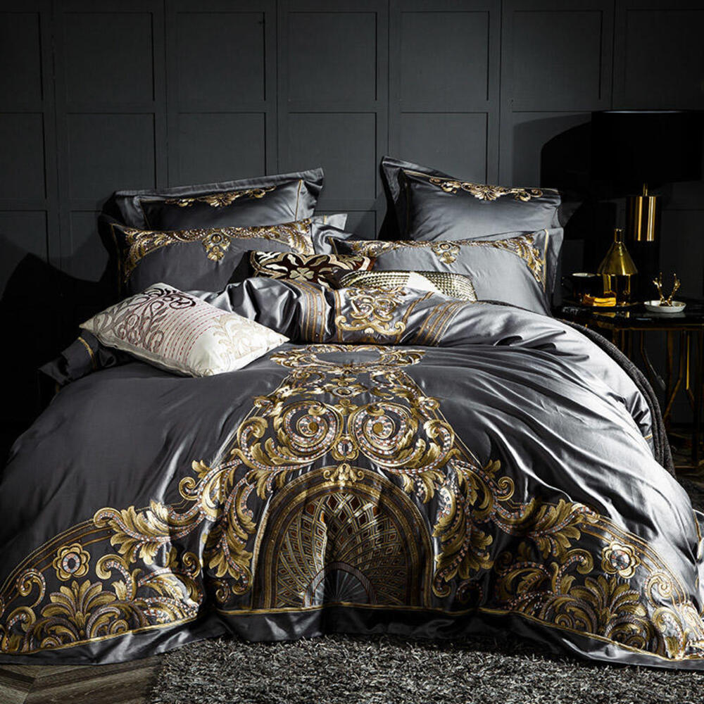 Luxurious bedspread with gold embroidery on a dark background