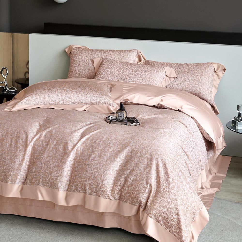 Rose gold bedding set on a bed in a bedroom setting