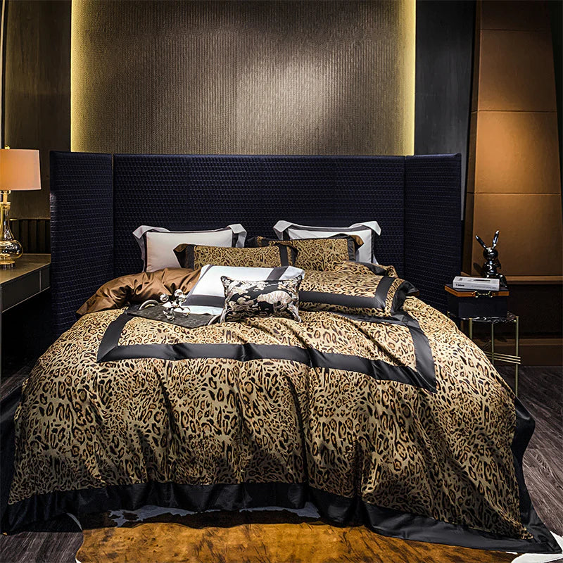 Bedroom with leopard print bedding and dark velvet headboard