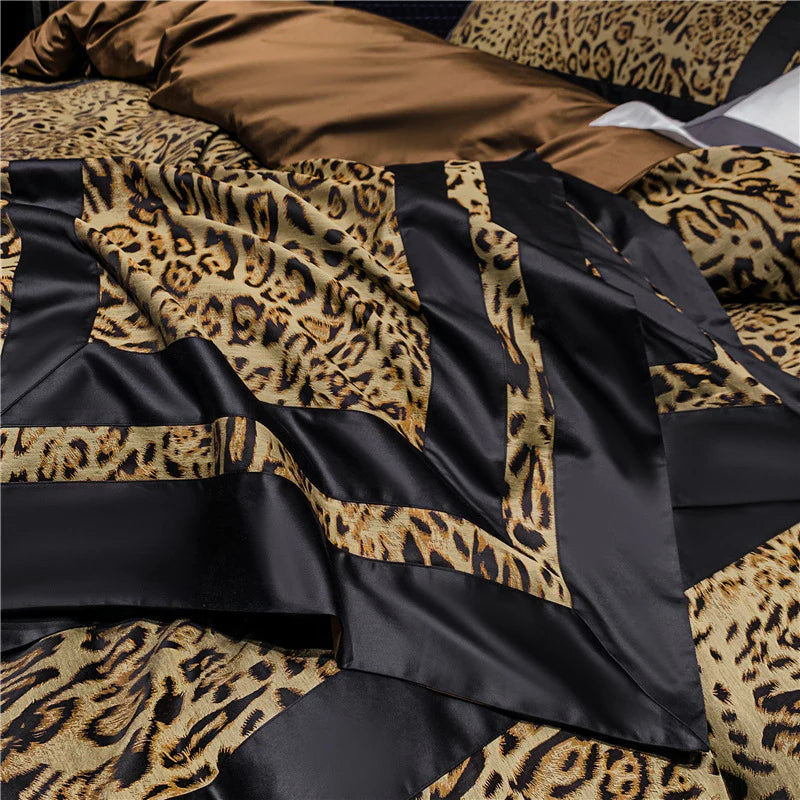 Leopard print bedding set with black ruffles on a bed.